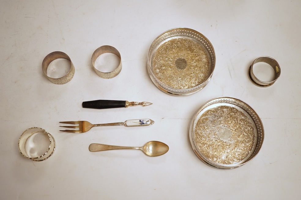 Two George V engine turned silver cigarette cases, largest 12.6cm, together with a pair of Asprey & Co silver ashtrays, a small silver dish, a silver condiment, six silver napkin rings, seven plated items and a quantity